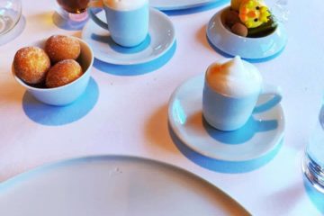 table with donuts, macarons, lattes