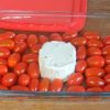 pyrex dish with grape tomatoes and boursin cheese